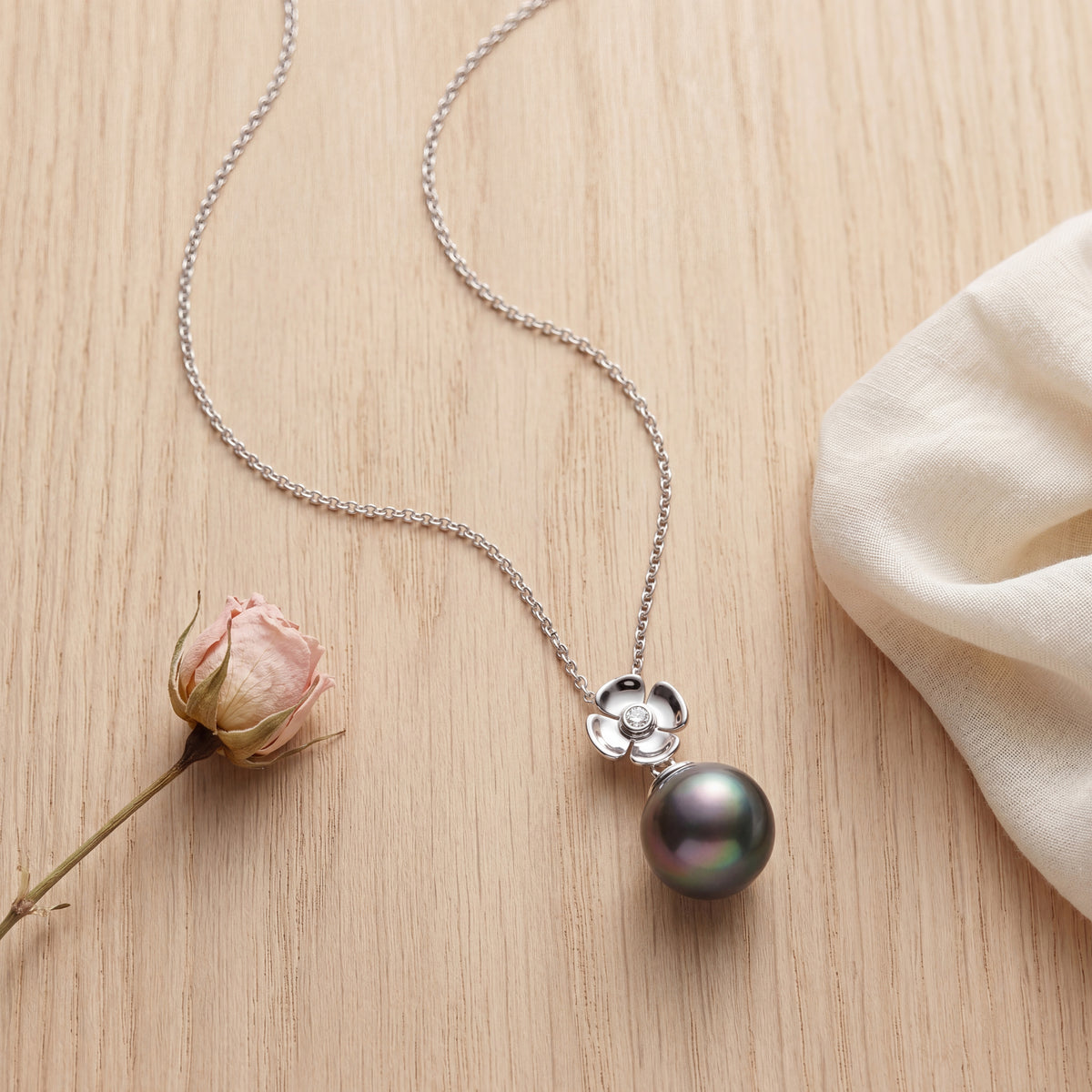 HANDCRAFTED 18CT WHITE GOLD FLOWER TAHITIAN PEARL AND DIAMOND PENDANT