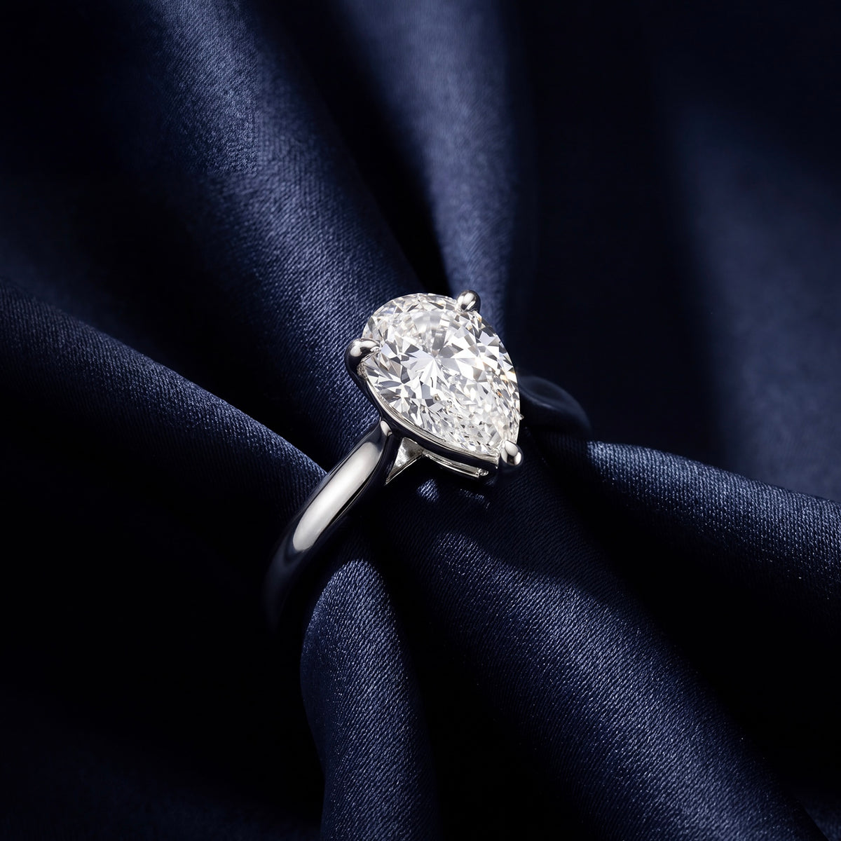 HANDCRAFTED PLATINUM 1.01CT PEAR SHAPED DIAMOND RING