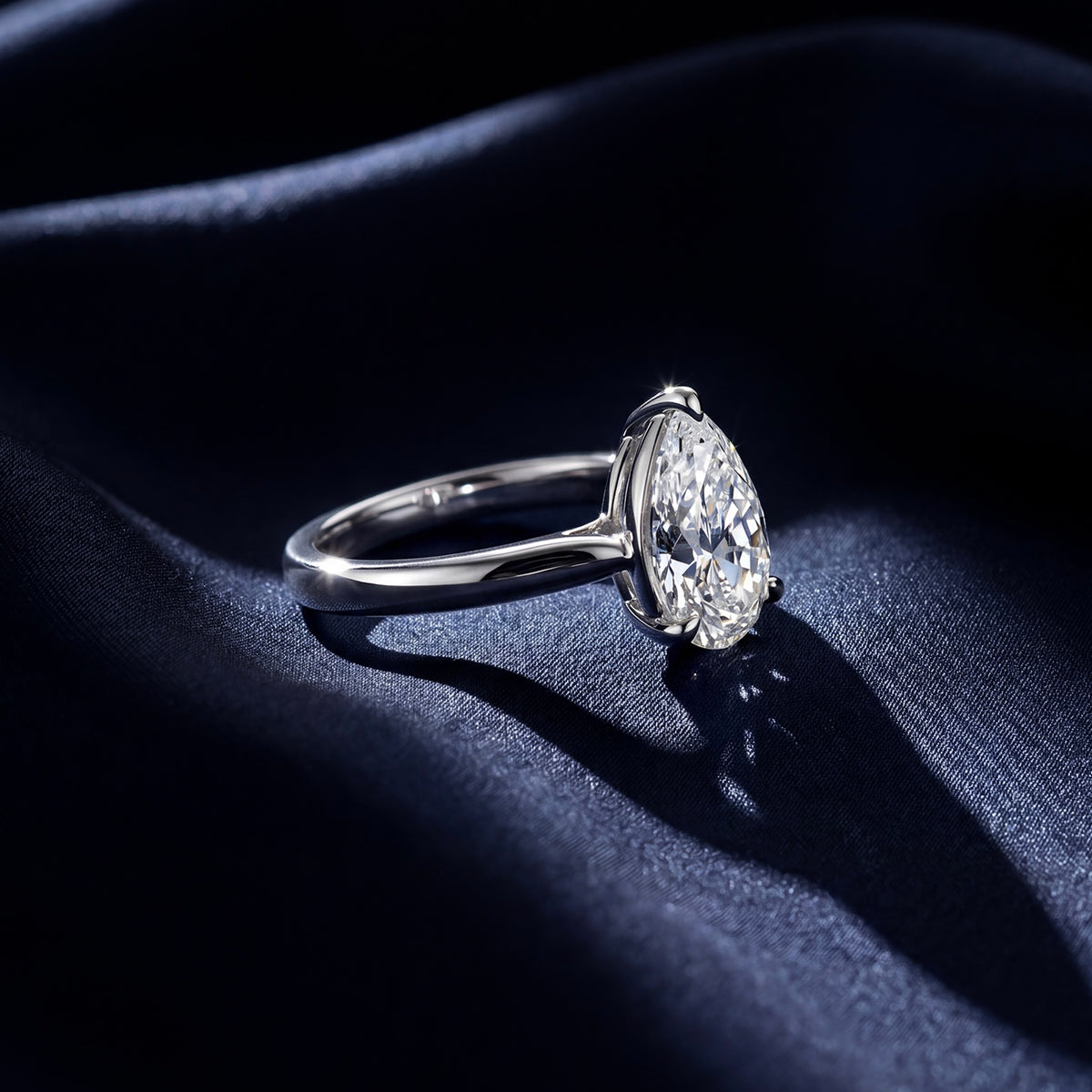 HANDCRAFTED PLATINUM 1.01CT PEAR SHAPED DIAMOND RING