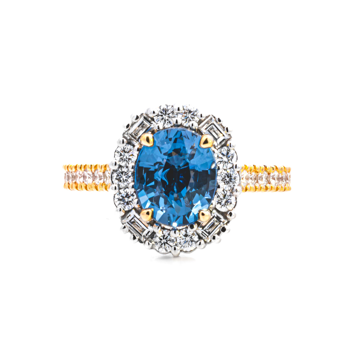 Oval blue gemstone ring with a diamond halo on a yellow gold diamond band, NY2K Jewellers, Maroochydore