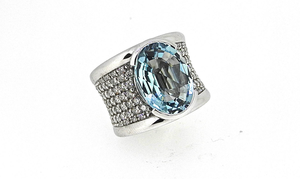 Wide white gold ring with an oval pale blue gemstone and pave diamonds, NY2K Jewellers, Maroochydore