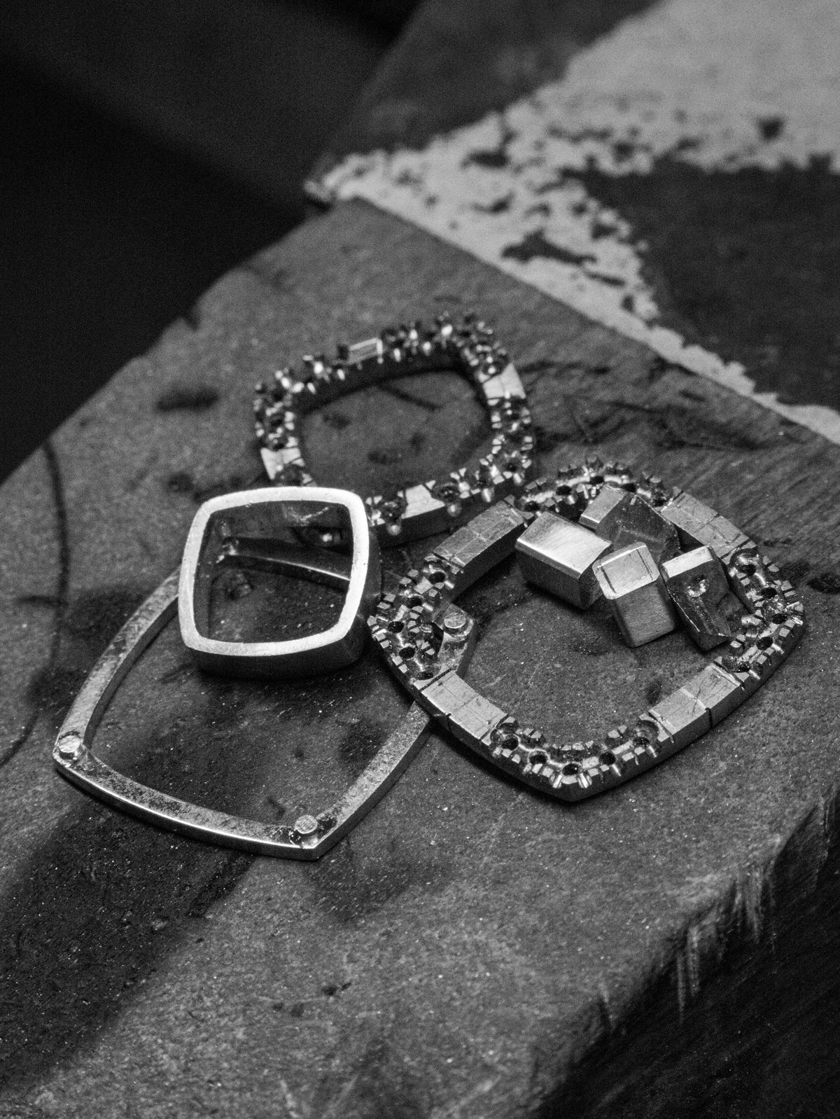 Components of the tanzanite pendant laid out on the bench peg before assembly