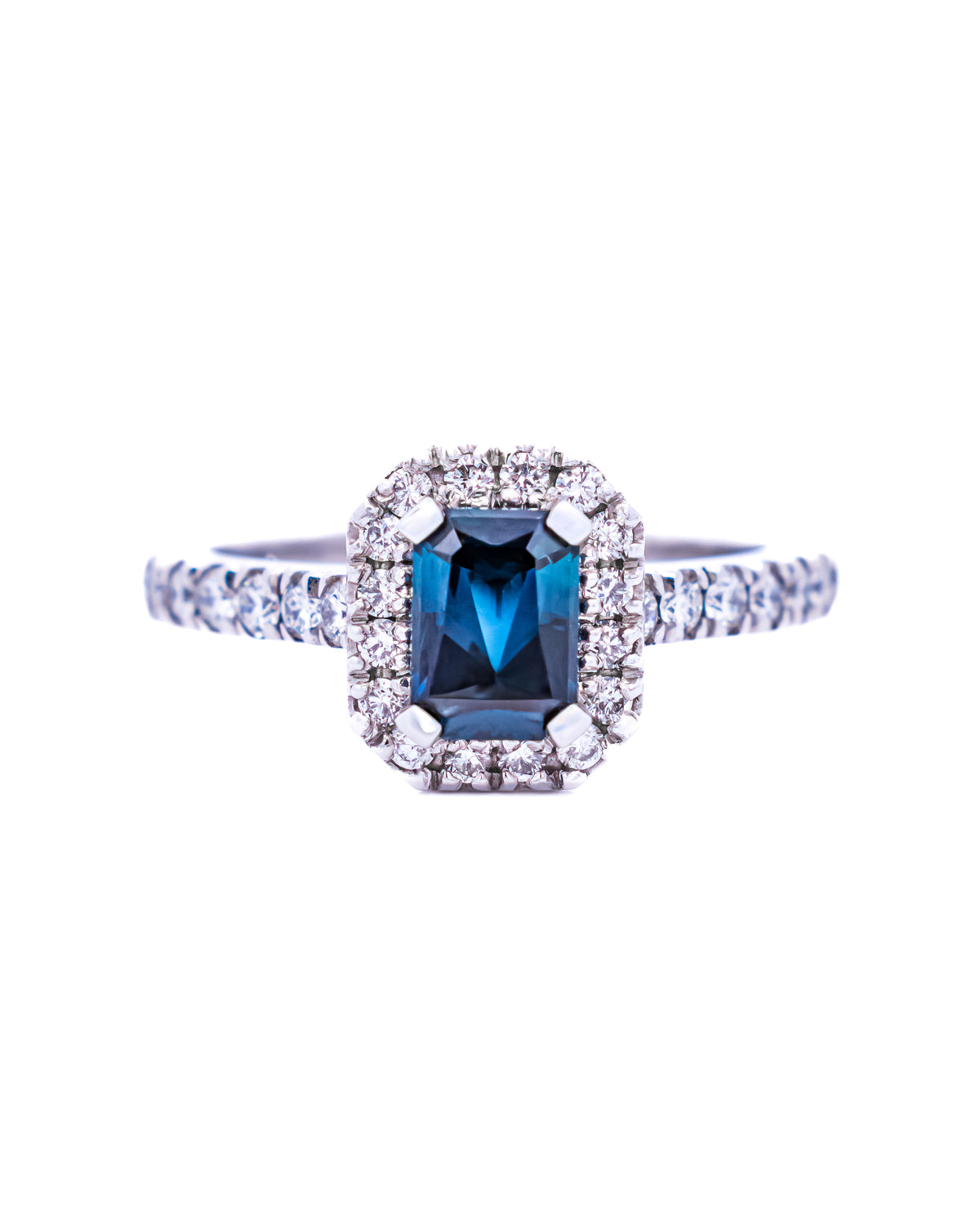 Emerald-cut teal blue gemstone ring with a diamond halo in white gold, NY2K Jewellers, Maroochydore