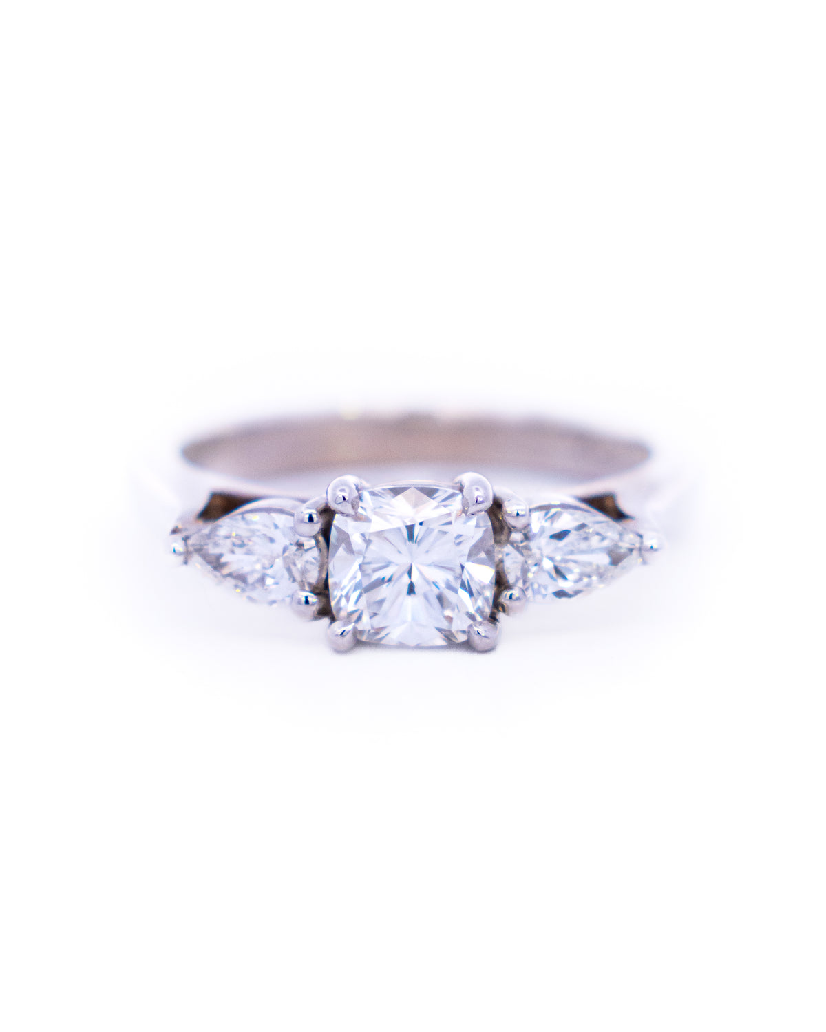Three-stone diamond ring with a cushion-cut centre and pear-cut sides in white gold, NY2K Jewellers, Maroochydore