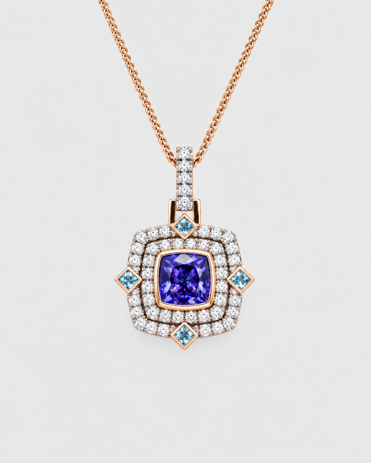 Tanzanite, aquamarine and diamond double halo pendant in 18ct gold, made by NY2K Jewellers