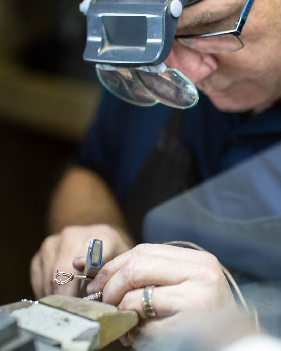 Master Jeweller Paul New at the bench at NY2K Jewellers, Cotton Tree