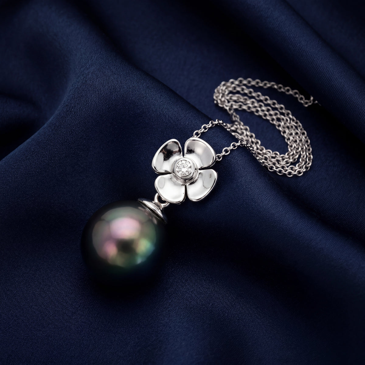 HANDCRAFTED 18CT WHITE GOLD FLOWER TAHITIAN PEARL AND DIAMOND PENDANT