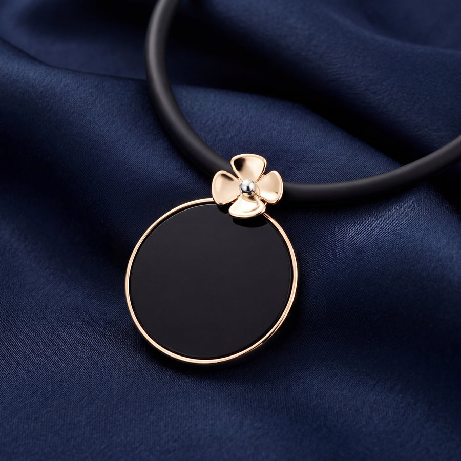9CT YELLOW GOLD ONYX FLOWER PENDANT
